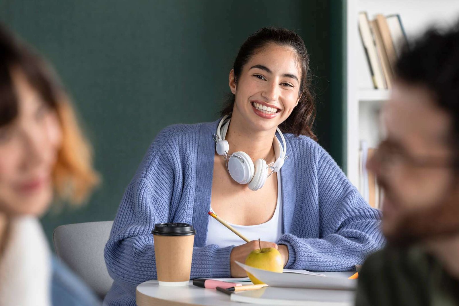 young woman taking notes in study session